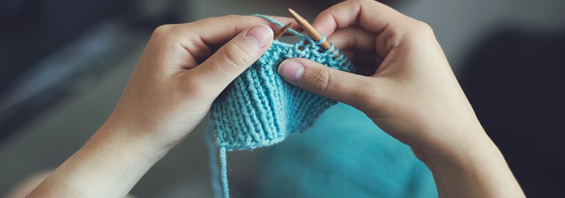Knitting blue yarn
