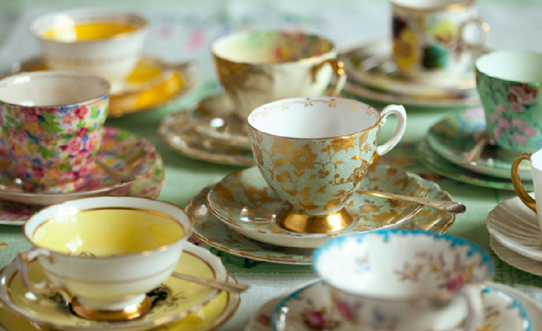 Many delicate multicolor tea cups and saucers in a group of 9 different patterns